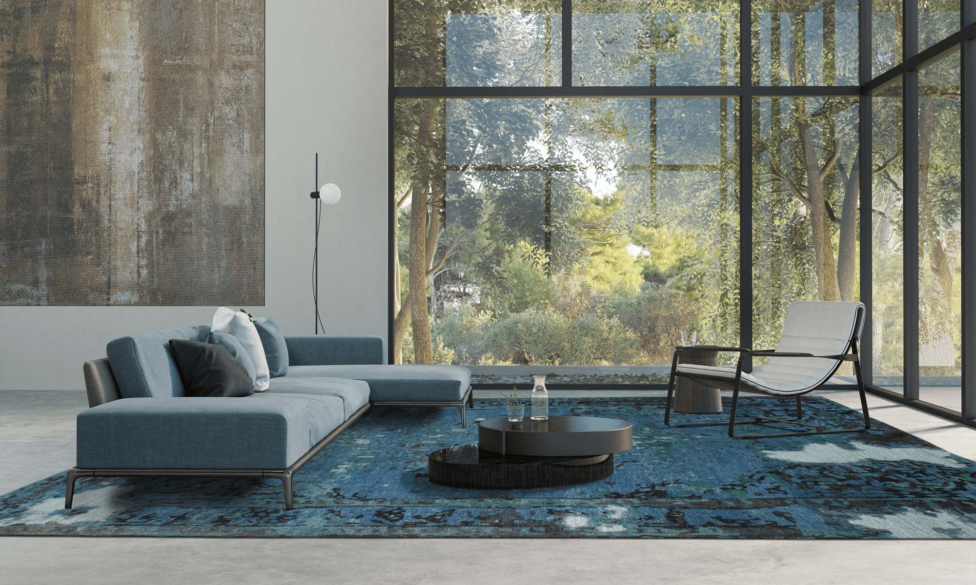 Wohnraum mit großer Glasfläche mit Blick in die Natur und Geba Teppich "Antique blue" - Geba Teppich