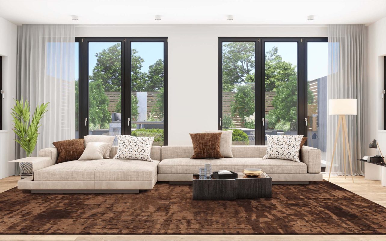 Wohnzimmer mit großer, heller Wohnlandschaft auf Geba Teppich "Quaran brown" - Geba Teppich
