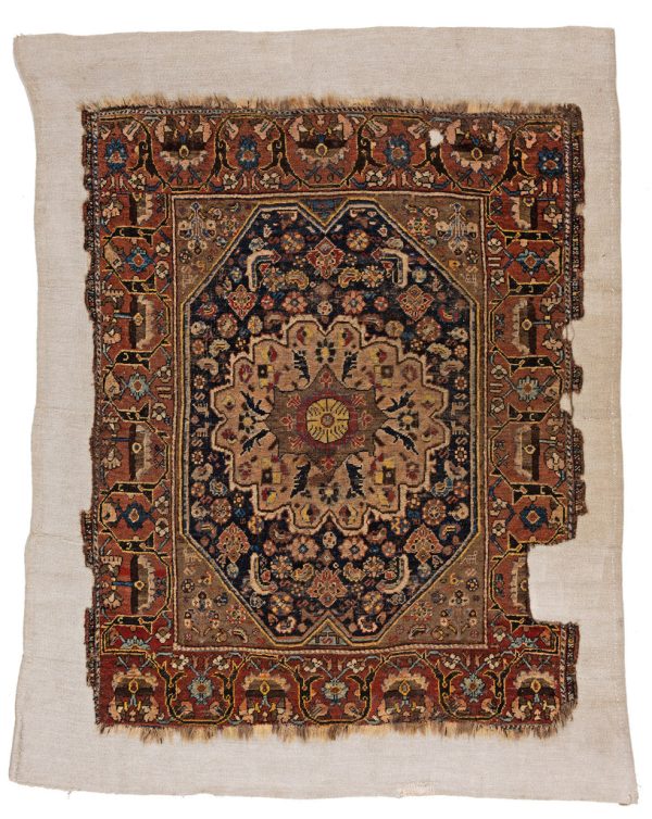 Vintage Gaschghai in Erdtönen und aufwendiger Musterung, aus dem Iran, aus Schafwolle gefertigt und genäht auf eine wollweißen Kelim aus Leinen - Produktbild - Geba Teppich